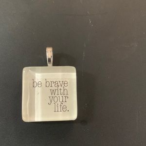 Necklace pendant 1”x1” “be brave with your life”clear resin. Chain not included.